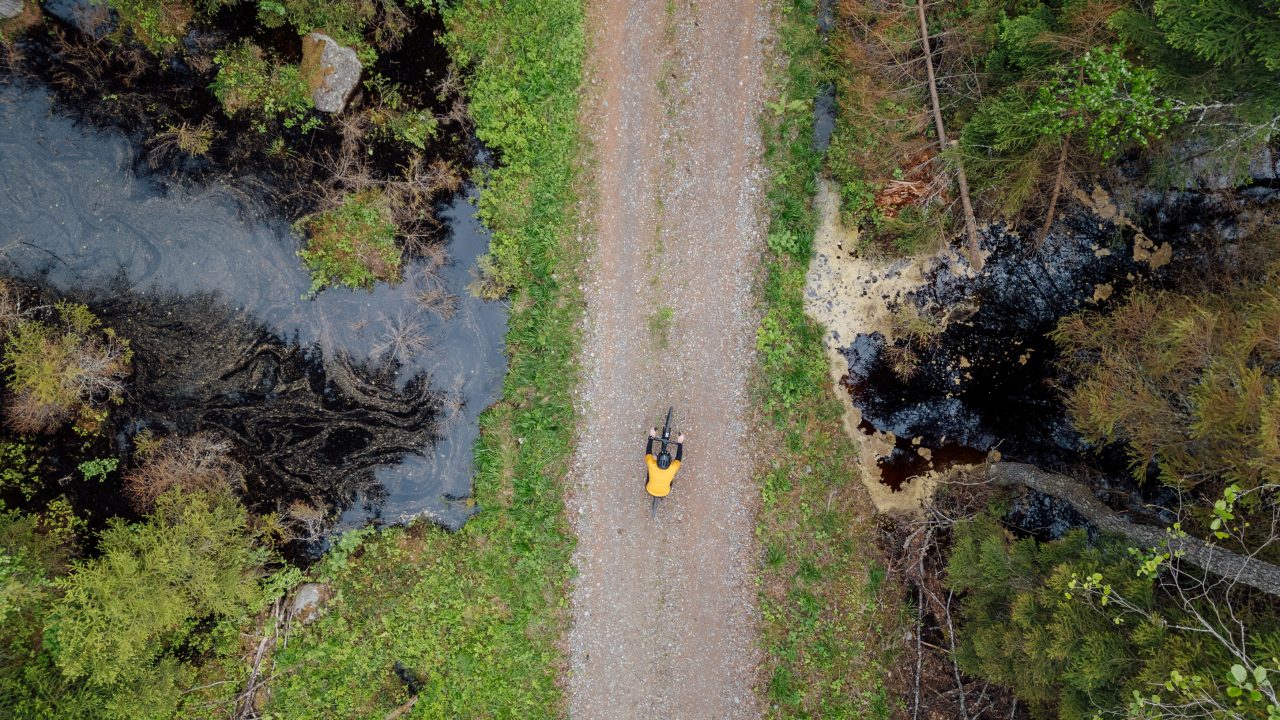 Cyclist is crossing a waters area.